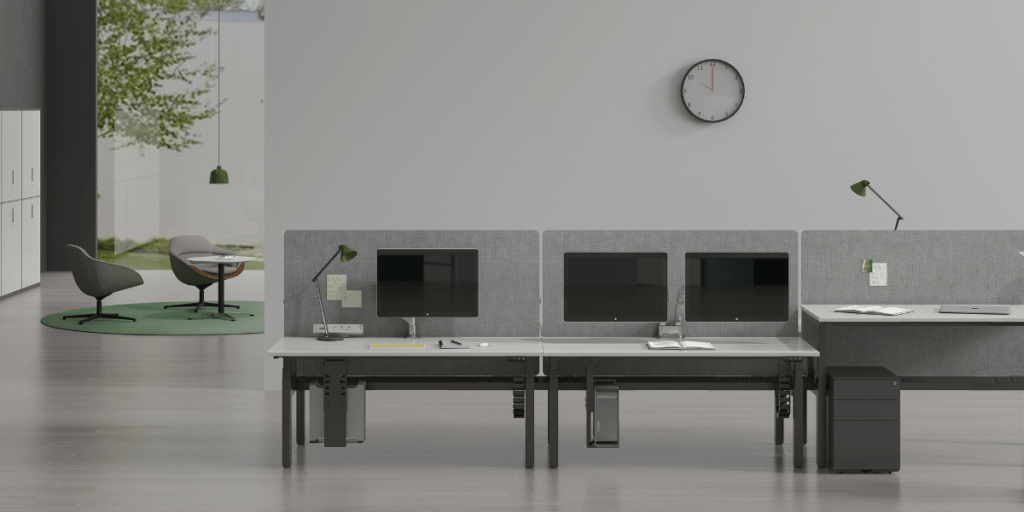 Modern Corporate Office: Relaxation Area, Adjustable Height Desks, and Screens for Productivity and Comfort